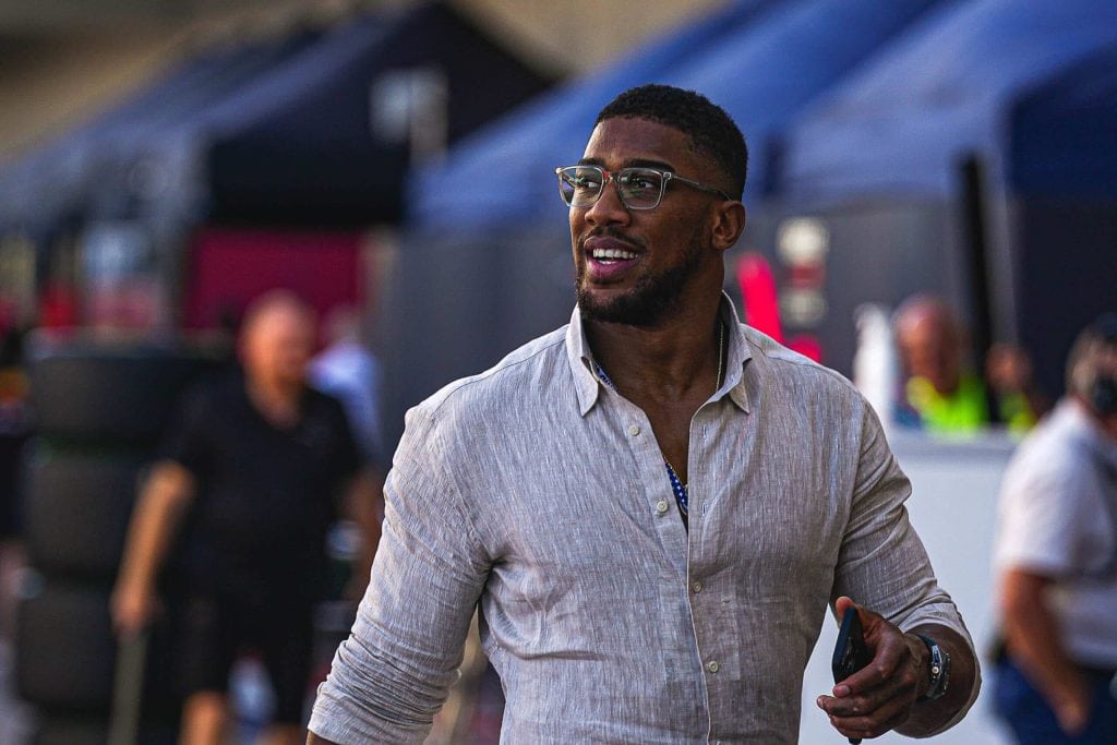 British boxer Anthony Joshua walks through the paddock area during the Formula 1 Lenovo United States Grand Prix at Circuit