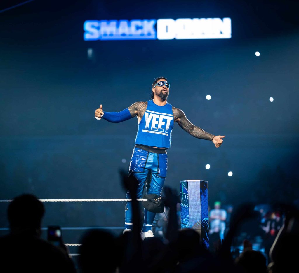 WWE superstar Jey Uso rallies the fans during his entrance.