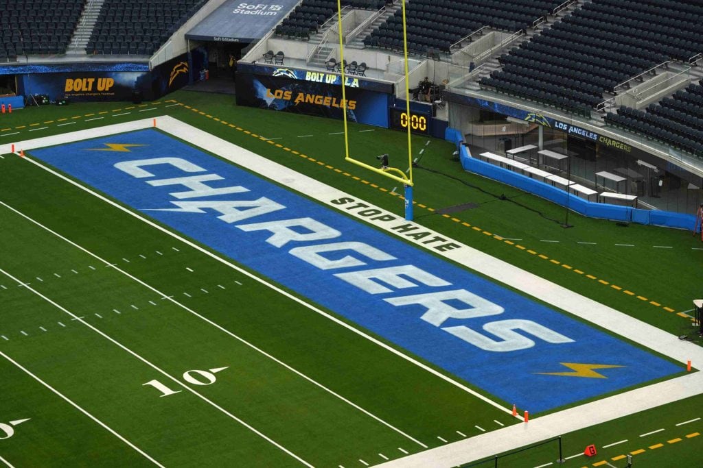 Sep 8, 2024; Inglewood, California, USA; The Los Angeles Chargers logo and words Stop Hate in the end zone at SoFi Stadium.