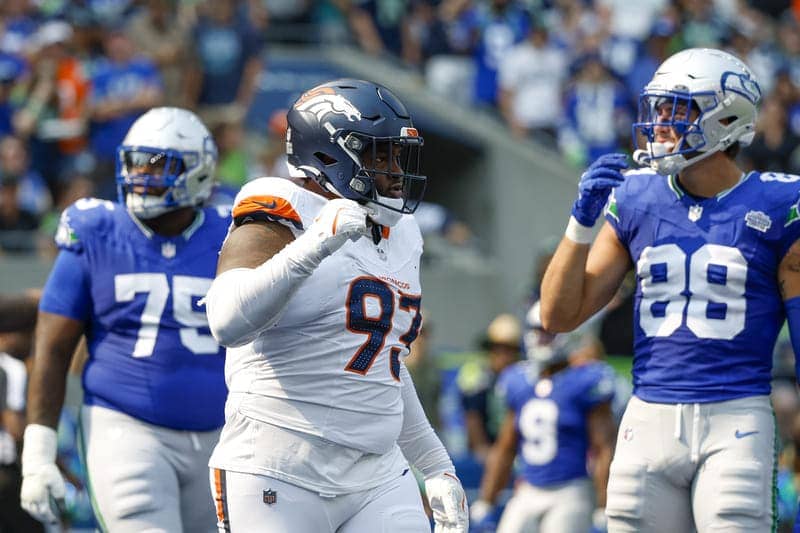 Sep 8, 2024; Seattle, Washington, USA; Denver Broncos defensive tackle D.J. Jones (93) celebrates a holding penalty against