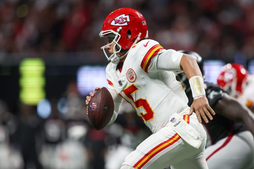 Sep 22, 2024; Atlanta, Georgia, USA; Kansas City Chiefs quarterback Patrick Mahomes (15) scrambles against the Atlanta