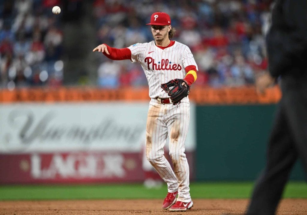 Sep 25, 2024; Philadelphia, Pennsylvania, USA; Philadelphia Phillies second baseman Bryson Stott (5) throws to first against