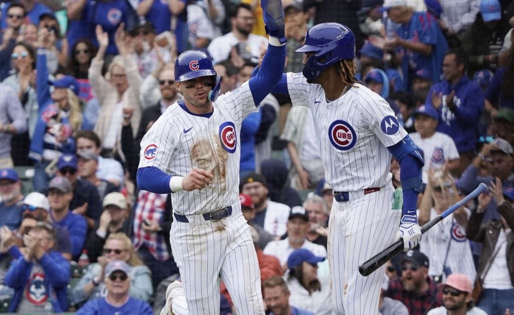 Sep 27, 2024; Chicago, Illinois, USA; Chicago Cubs second baseman Nico Hoerner (2) is greeted by outfielder Kevin Alcantra