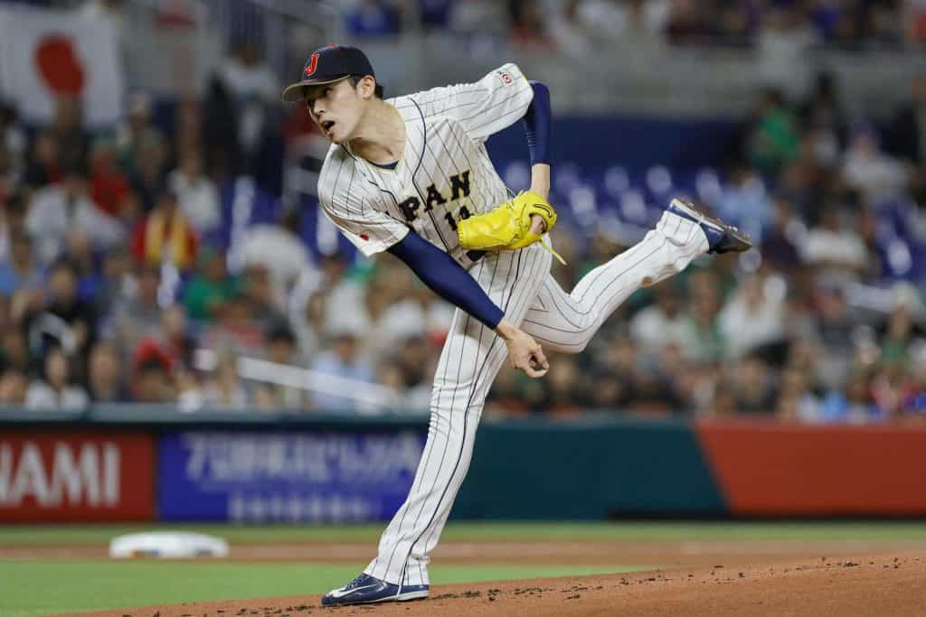 Mar 20, 2023; Miami, Florida, USA; Japan starting pitcher Roki Sasaki (14) delivers a pitch during the first inning against