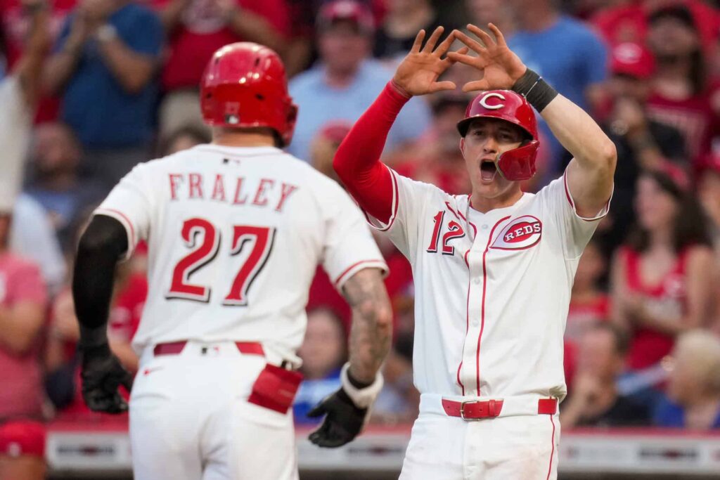 Cincinnati Reds right fielder Jake Fraley (27) crosses the plate on a two-run home run in the fourth inning of the MLB