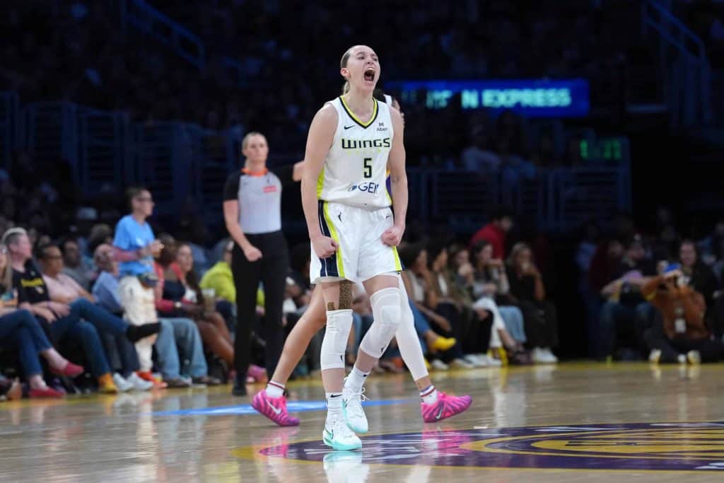 Dallas Wings guard Paige Bueckers celebrates against the LA Sparks in 2025, ahead of Wings vs. Valkyries Game 3