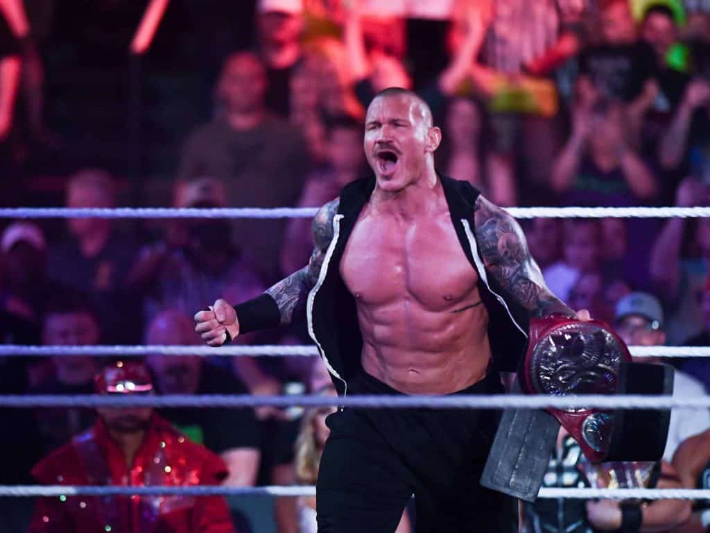 WWE wrestler Randy Orton yells out into the a cheering crowd as he makes an appearance for a 20-year celebration as a