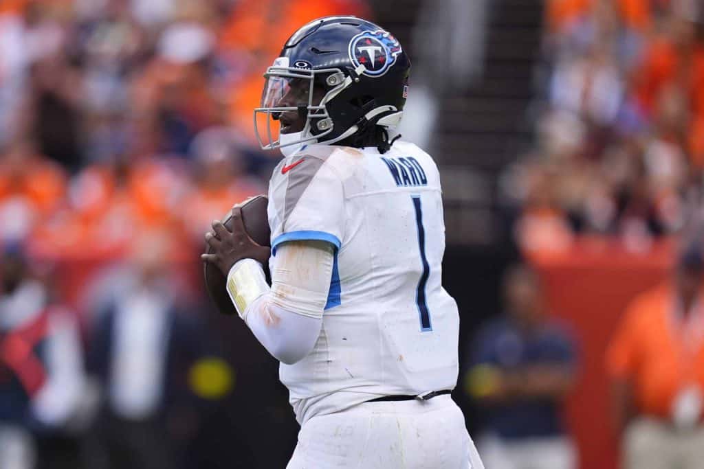 Sep 7, 2025; Denver, Colorado, USA; Tennessee Titans quarterback Cam Ward (1) drops back to pass against the Denver Broncos