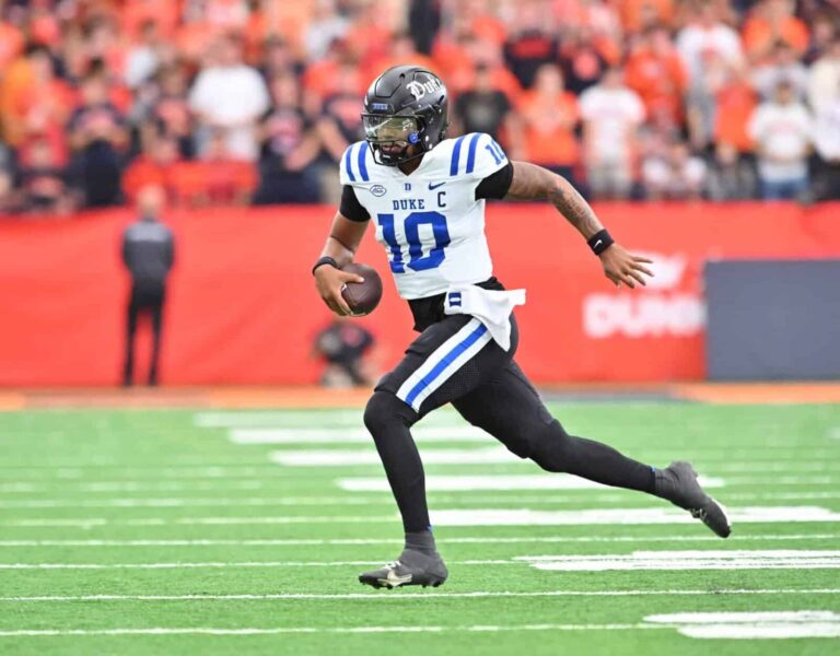 Miami vs. Clemson: Darian Mensah, then Duke quarterback, runs out of the pocket at Syracuse in September 2025