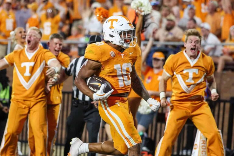 Tennessee Volunteers running back DeSean Bishop (18) runs for a touchdown during overtime against the Mississippi State Bulldogs at Davis Wade Stadium at Scott Field.
