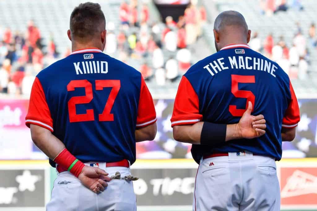 Los Angeles Angels center fielder Mike Trout (27) and first baseman Albert Pujols (5) during the national anthem before the