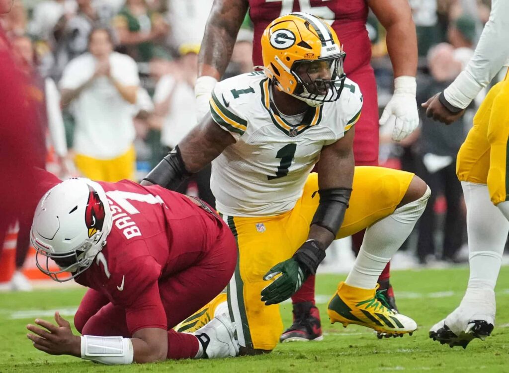 Arizona Cardinals quarterback Jacoby Brissett (7) is sacked by Green Bay Packers defensive lineman Micah Parsons (1) at