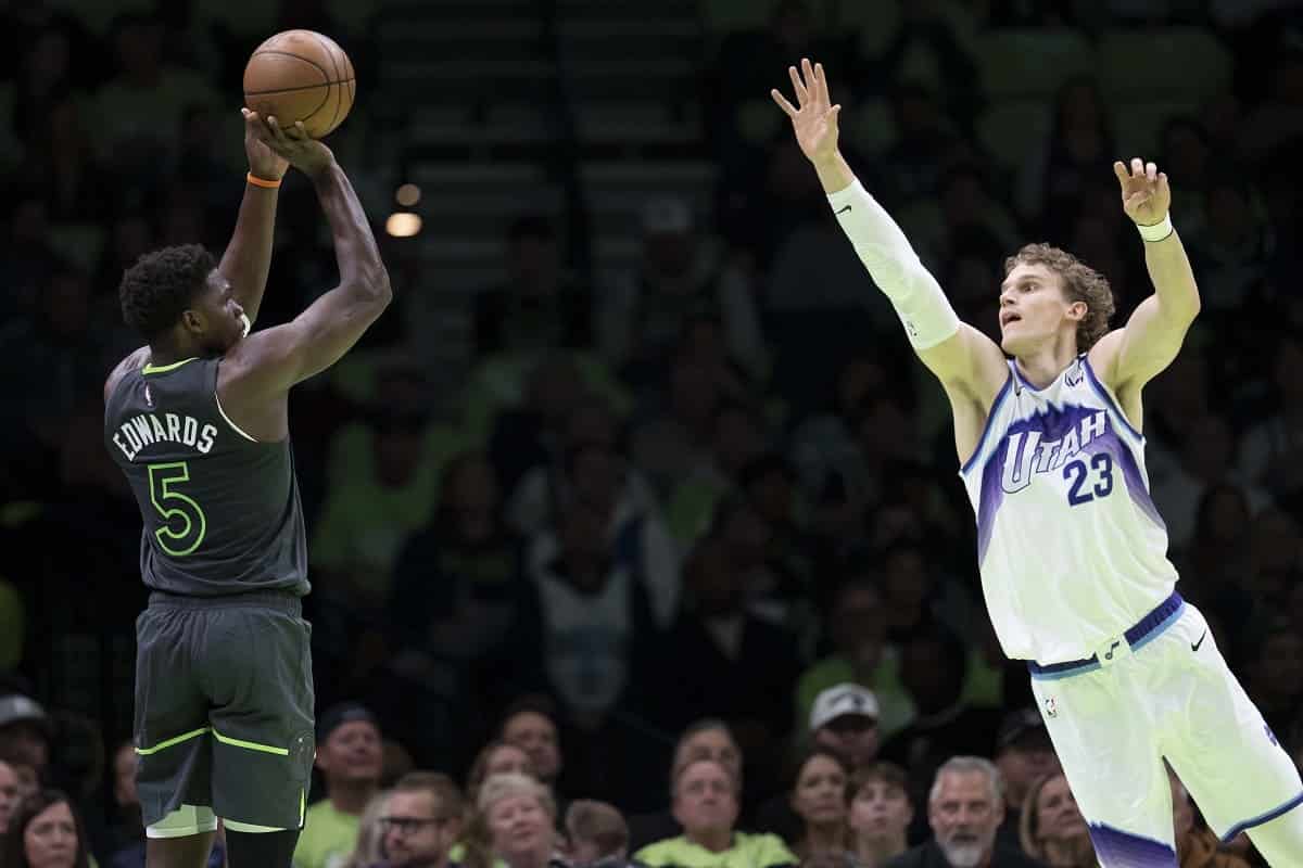 Minnesota Timberwolves guard Anthony Edwards (5) shoots the ball over Utah Jazz forward Lauri Markkanen (23) in the first half at Target Center.