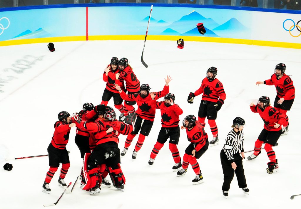 Canada celebrates their gold medal win over the United States during the Beijing 2022 Olympic Winter Games at Wukesong