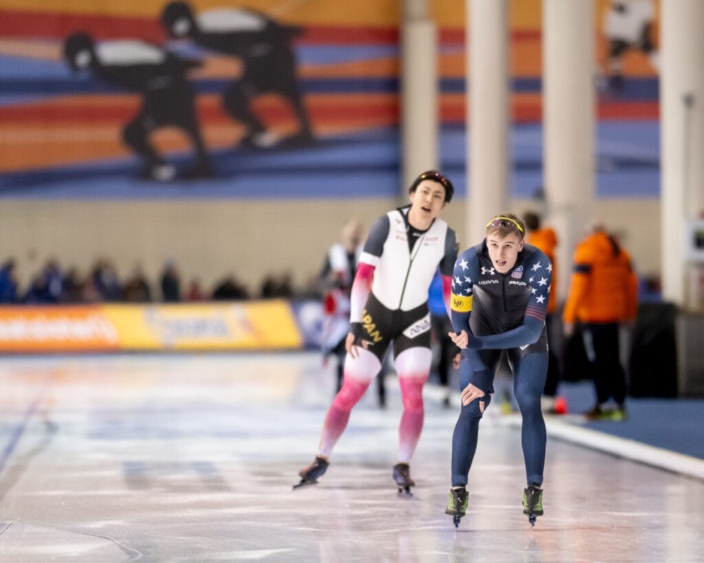 Jordan Stolz of the United States, foreground, and Tatsuya Shinhama of Japan race cool down after racing in the men’s 500