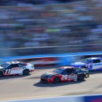 Denny Hamlin leads Christopher Bell and Kyle Larson at Phoenix in March 2025, ahead of their South Point 400 title fight at Las Vegas
