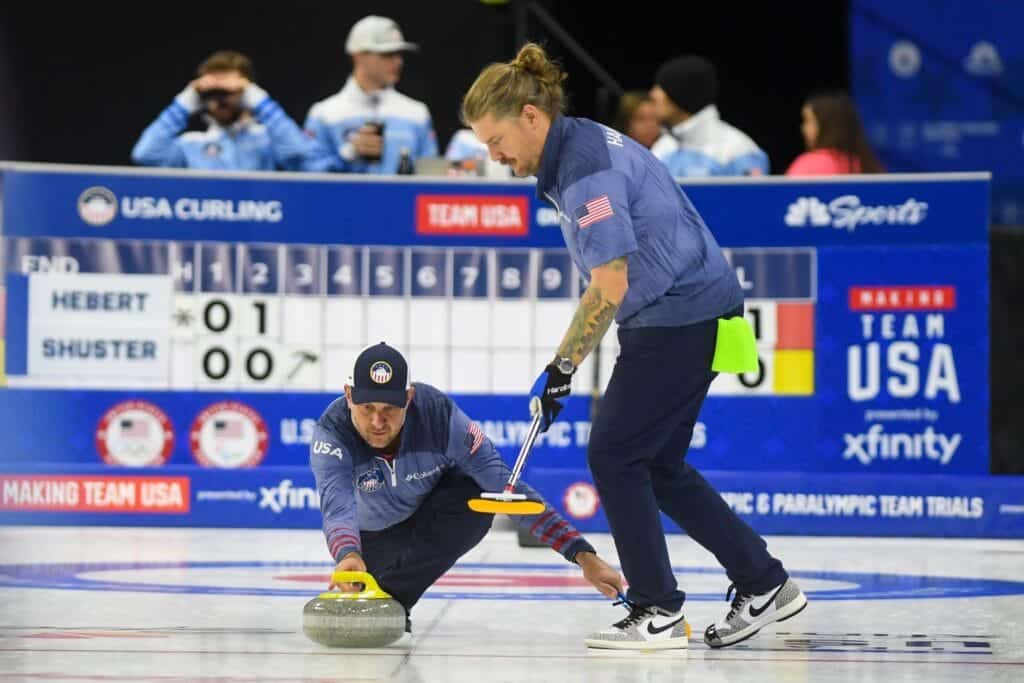 John Shuster, with Team Shuster, delivers the stone to the ice during the U.S. Olympic Curling Team Trials on Tuesday, Nov.