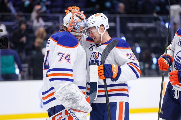 Goalie Stuart Skinner celebrates with Curtis Lazar while with Edmonton in 2025, before his Bruins vs. Jets start for Winnipeg
