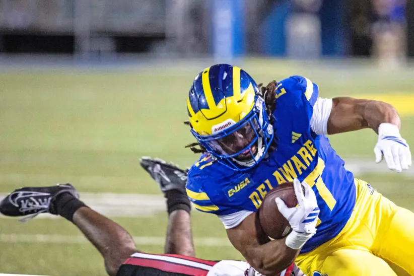 Delaware running back Jo Silver is tackled by Western Kentucky at Delaware Stadium in October 2025