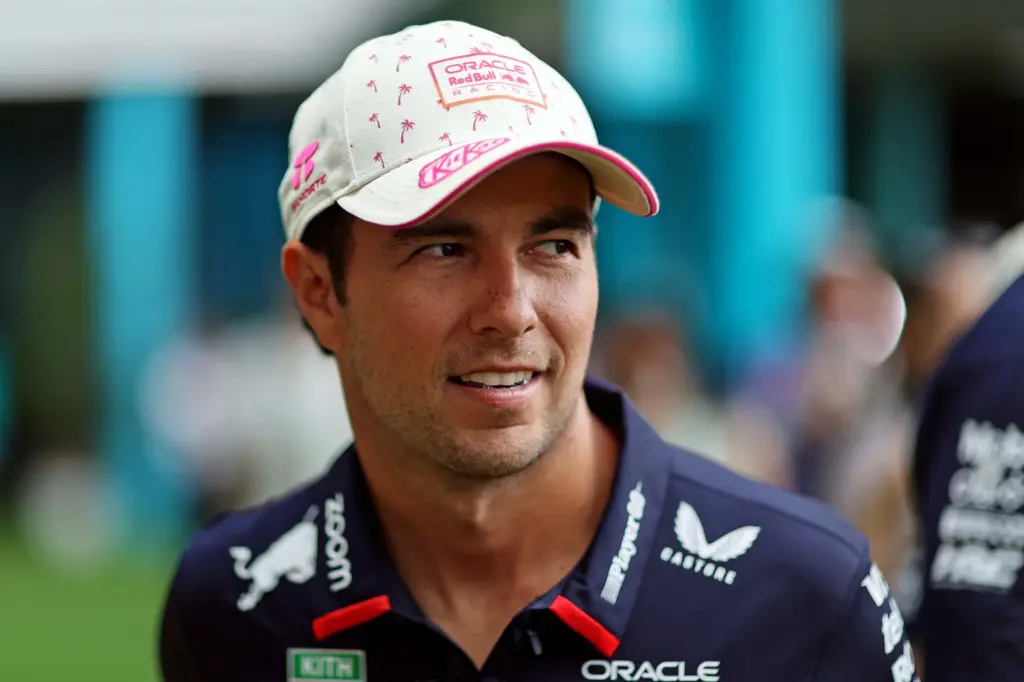 May 5, 2024; Miami Gardens, Florida, USA; Red Bull Racing driver Sergio Perez (11) walks in the paddock before the F1 Miami Grand Prix at Miami International Autodrome. Mandatory Credit: Peter Casey-Imagn Images