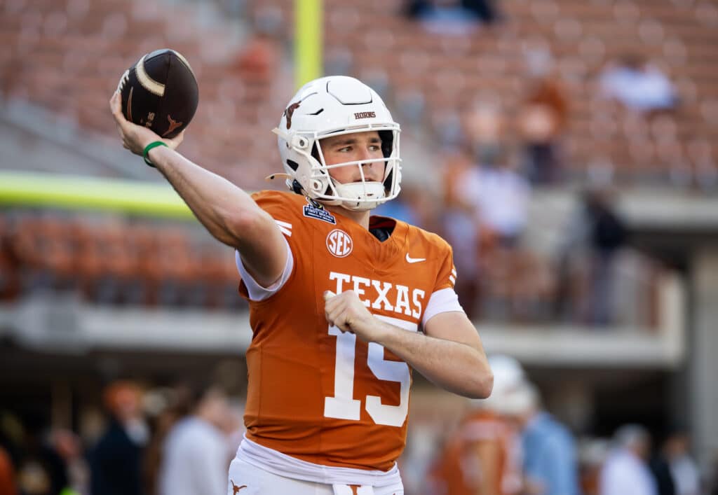 Texas quarterback Trey Owens in a December 2024 CFP first-round game in Austin, the kind of campus game a 24-team CFP format would expand