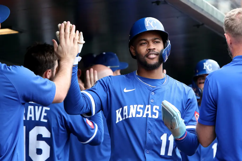Kansas City Royals Maikel Garcia celebrating in the dugout
