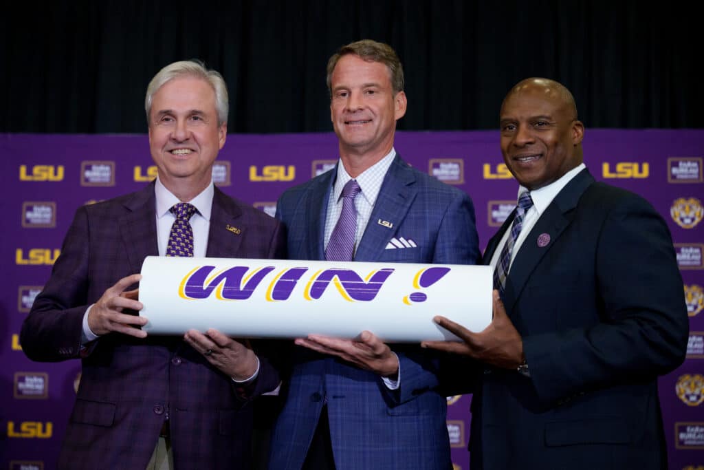LSU vs. McNeese: LSU coach Lane Kiffin stands with president Wade Rousse and athletic director Verge Ausberry at Tiger Stadium in December 2025