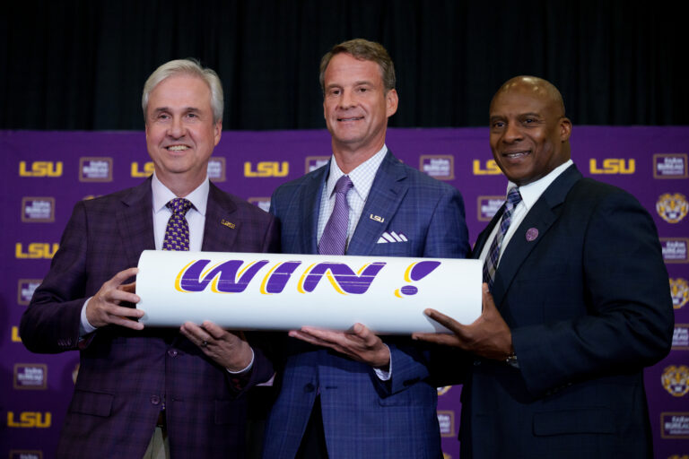 LSU vs. McNeese: LSU coach Lane Kiffin stands with president Wade Rousse and athletic director Verge Ausberry at Tiger Stadium in December 2025
