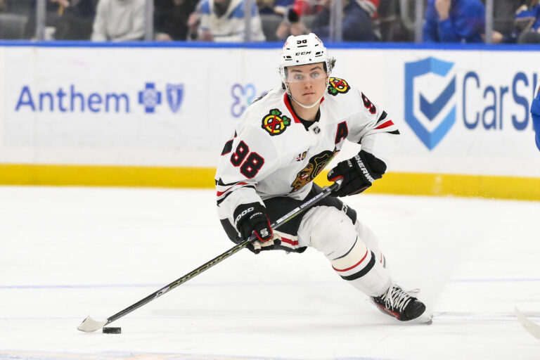 Blackhawks center Connor Bedard controls the puck in December 2025; Bedard misses Blackhawks vs. Mammoth with a shoulder injury
