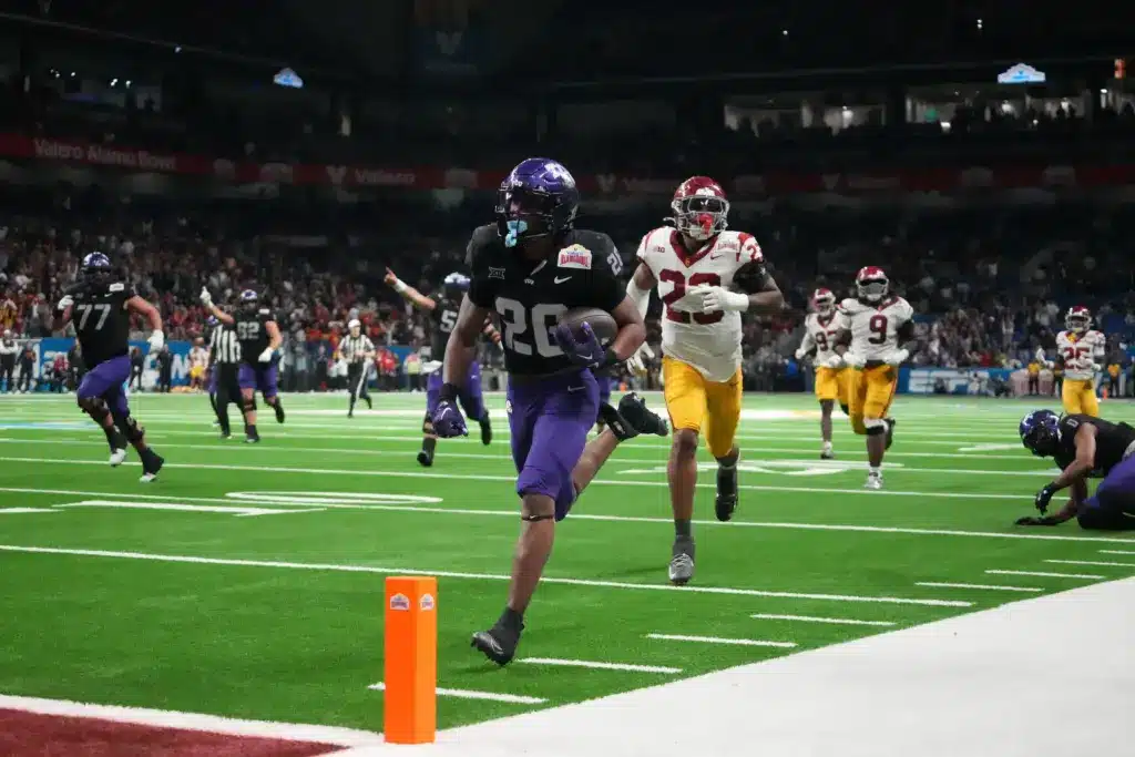 Dec 30, 2025; San Antonio, TX, USA; TCU Horned Frogs running back Jeremy Payne (26) scores on a 35-yard touchdown reception in overtime for the winning score against the Southern California Trojans during the Alamo Bowl at Alamodome. Mandatory Credit: Kirby Lee-Imagn Images