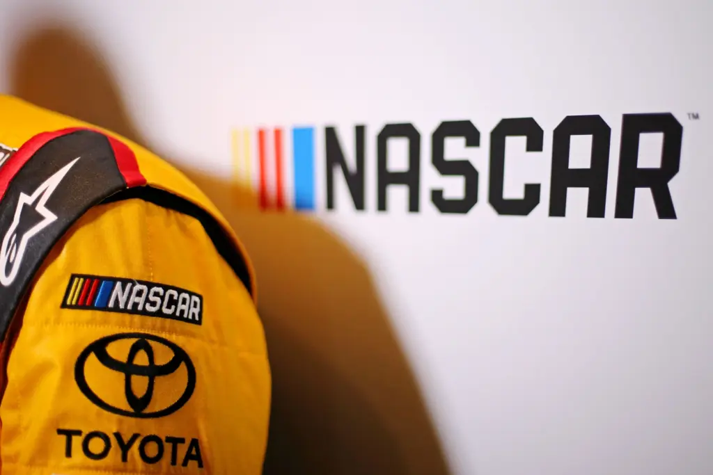 Kid Racers; Feb 22, 2017; Daytona Beach, FL, USA; A view of the NASCAR logo and the Toyota logo on the fire suit of NASCAR Cup Series driver Kyle Busch during Daytona 500 media day at Daytona International Speedway. Mandatory Credit: Peter Casey-Imagn Images