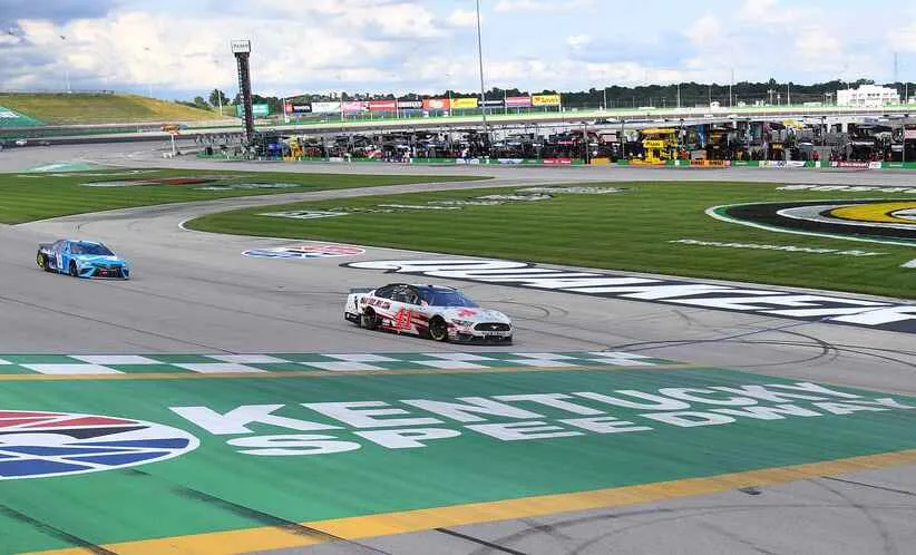 Caption: Jul 12, 2020; Sparta, Kentucky, USA; Monster Energy NASCAR Cup Series driver Cole Custer (41) holds off Monster Energy NASCAR Cup Series driver Martin Truex Jr. (19) late in the race to win the Quaker State 400 at Kentucky Speedway. Mandatory Credit: Christopher Hanewinckel-Imagn Images