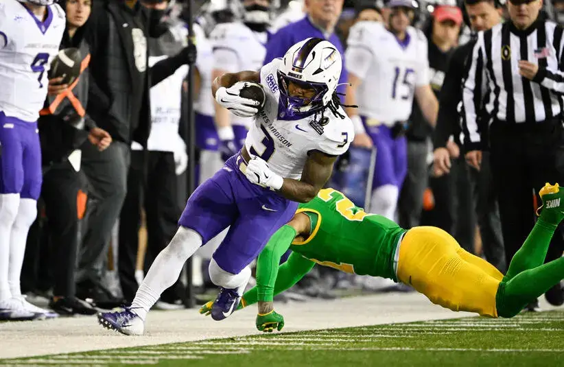 Wayne Knight performing a tightrope act on the sideline vs Oregon in the first round of the CFP