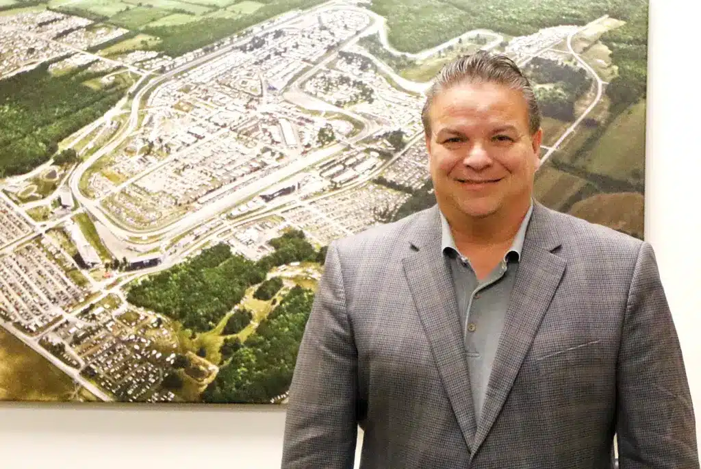 Former Watkins Glen International President Michael Printup stands in front of a map of the track in the media center in 2023.