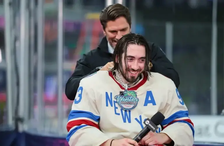 New York Rangers center Mika Zibanejad (93) receives a necklace from Henrik Lundqvist after being named MVP of the 2026 Winter Classic