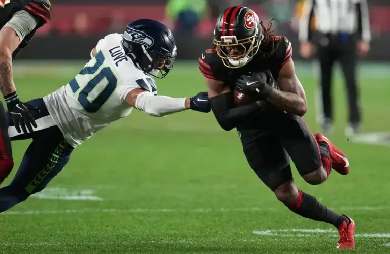 San Francisco 49ers wide receiver Demarcus Robinson (5) makes catch against Seattle Seahawks safety Julian Love (20) during the second half