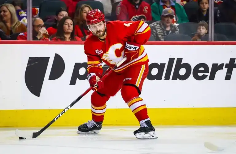 Rasmus Andersson Calgary Flames control pucks against Nashville Predators