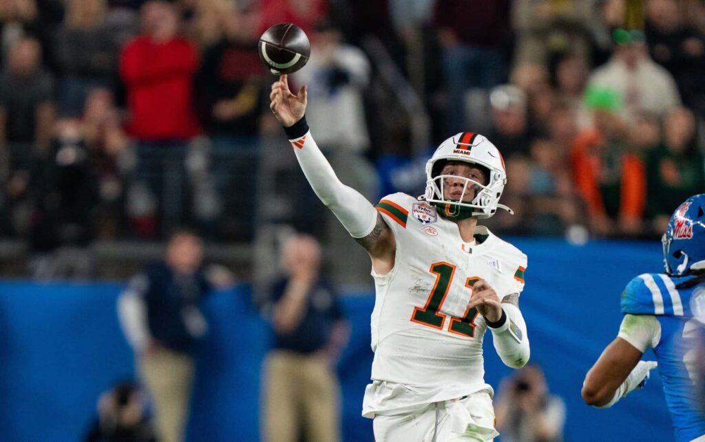 Miami Hurricanes quarterback Carson Beck (11) throws during the CFP Fiesta Bowl against Miami at the State Farm Stadium, in