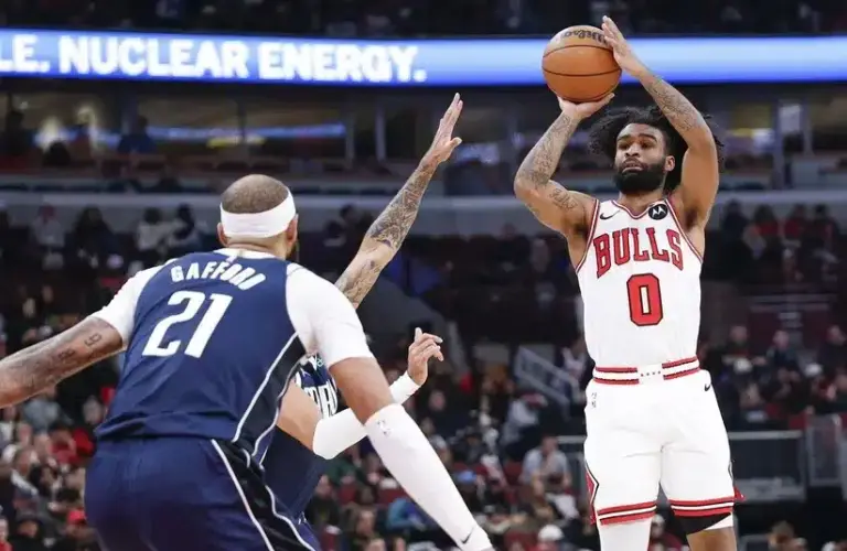 Chicago Bulls guard Coby White (0) shoots against the Dallas Mavericks during the first half at United Center.