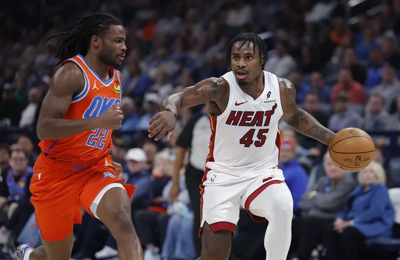 Miami Heat guard Davion Mitchell (45) drives down the court beside Oklahoma City Thunder guard Cason Wallace (22) during the second quarter at Paycom Center