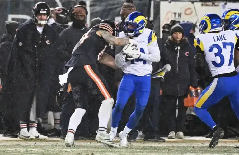 Los Angeles Rams cornerback Cobie Durant (14) intercepts a pass intended for Chicago Bears tight end Colston Loveland (84) during the third quarter of an NFC Divisional Round game at Soldier Field, Dallas Cowboys