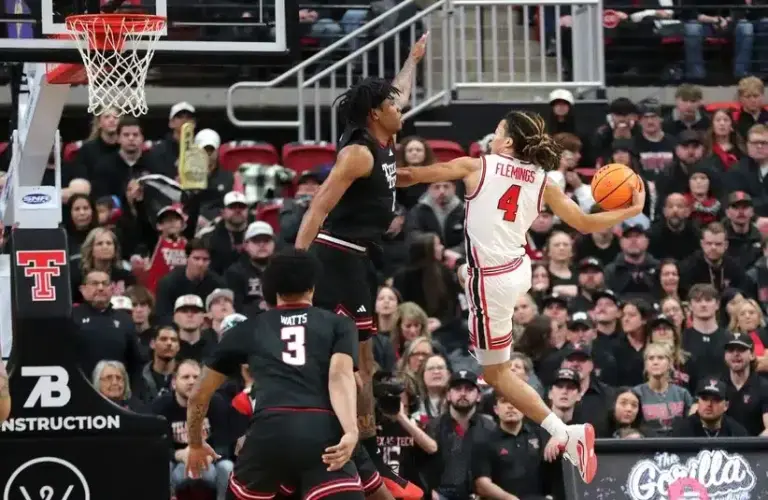 Houston Cougars guard Kingston Flemings (4) goes high to shoot against Texas Tech Red Raiders forward JT Toppin (15) in the first half at United Supermarkets Arena.