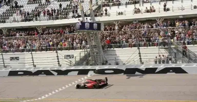 Felipe Nasr crosses the finish line to win the third straight Rolex 24 for the No. 7 Penske Porsche team, Sunday, Jan. 25, 2026 at Daytona International Speedway.