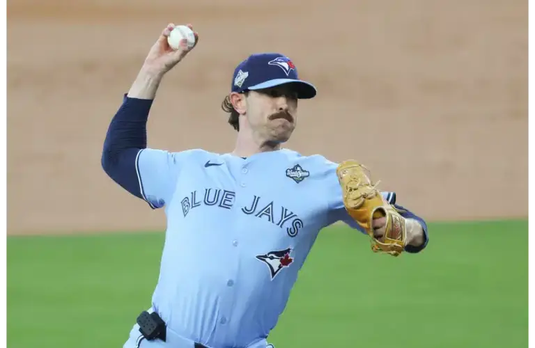Toronto Blue Jays pitcher Shane Bieber (57) pitches during the first inning against the Los Angeles Dodgers during game four of the 2025 MLB World Series at Dodger Stadium.