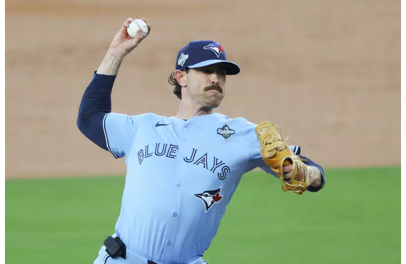 Toronto Blue Jays pitcher Shane Bieber (57) pitches during the first inning against the Los Angeles Dodgers during game four of the 2025 MLB World Series at Dodger Stadium.