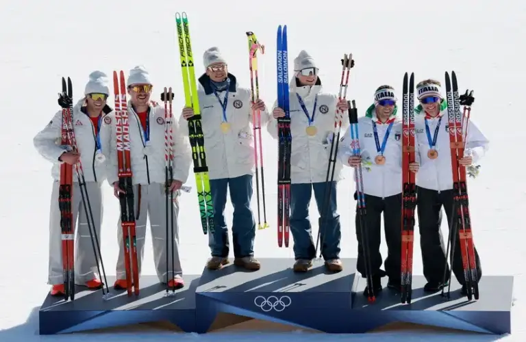 [US, Mexico & Canada customers only] Feb 18, 2026; Tesero, Italy; Gold medalists Einar Hedegart of Norway and Johannes Hoesflot Klaebo of Norway celebrate with silver medallsts Ben Ogden of United States and Gus Schumacher of United States and bronze medalists Elia Barp of Italy and Federico Pellegrino of Italy in the men's cross country skiing team sprint freestyle final during the Milano Cortina 2026 Olympic Winter Games at Tesoro Cross-Country Skiing Stadium.