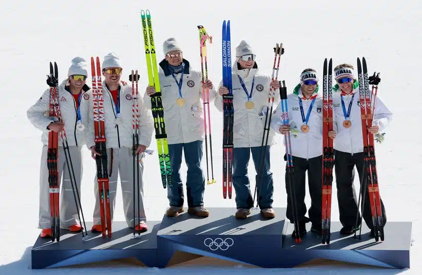 [US, Mexico & Canada customers only] Feb 18, 2026; Tesero, Italy; Gold medalists Einar Hedegart of Norway and Johannes Hoesflot Klaebo of Norway celebrate with silver medallsts Ben Ogden of United States and Gus Schumacher of United States and bronze medalists Elia Barp of Italy and Federico Pellegrino of Italy in the men's cross country skiing team sprint freestyle final during the Milano Cortina 2026 Olympic Winter Games at Tesoro Cross-Country Skiing Stadium.