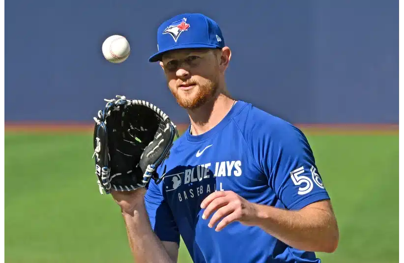 Toronto Blue Jays pitcher Eric Lauer (56) fields the ball during workouts at Rogers Centre.