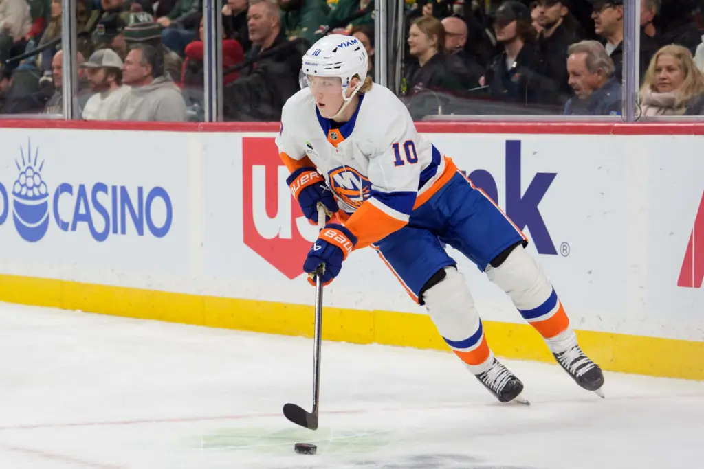 Jan 10, 2026; Saint Paul, Minnesota, USA; New York Islanders right wing Simon Holmstrom (10) skates with the puck against New York Islanders in the second period at Grand Casino Arena.