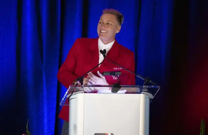 Wambach smiling while looking at the audience